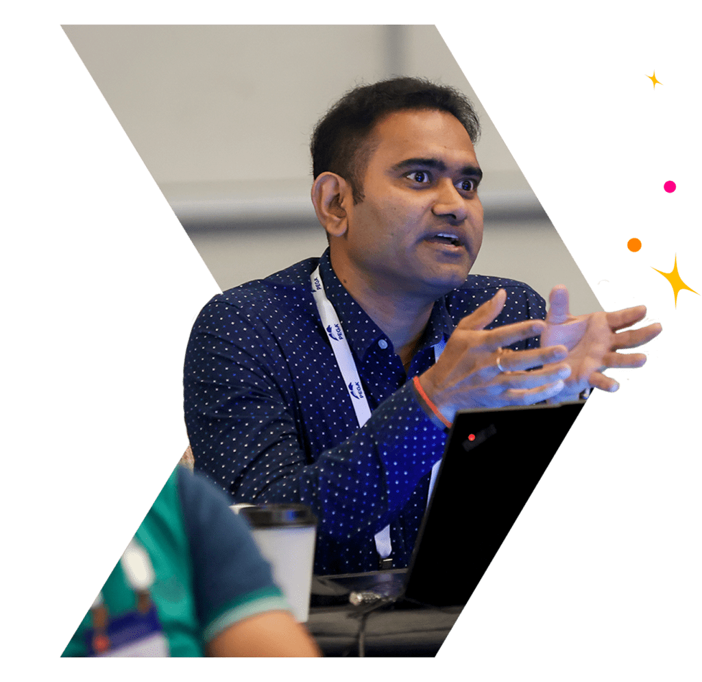 Image of a man at a conference speaking