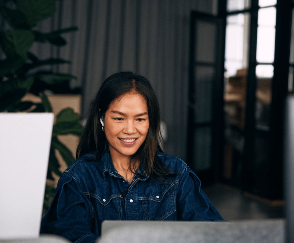 Stock image of a woman working on a laptop